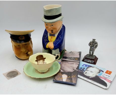 A collection of assorted Sir Winston Churchill related items to include a Spode Toby jug, a Paragon tea cup and saucer anothe
