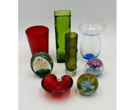 A small collection of art glass vases and paperweights including Dartington, Caithness etc