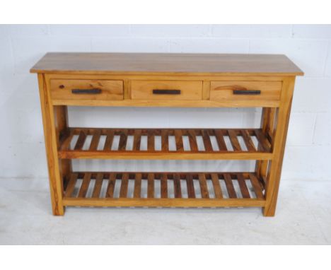 A modern hardwood console table, with three drawers - length 130cm, depth 35cm, height 85cm