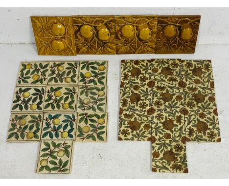 A collection of antique tiles including ten Minton "Pomegranate" tile, four Minton "Apple" tiles and ten others (no makers na