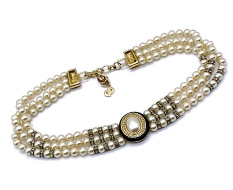 A vintage Christian Dior simulated triple strand pearl and paste choker.