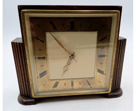 An Art Deco oak cased mantle clock by Garrad, eight day movement, 15cm high.