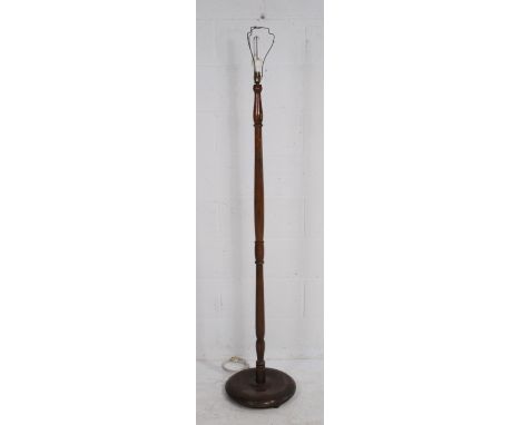 A turned wooden standard lamp