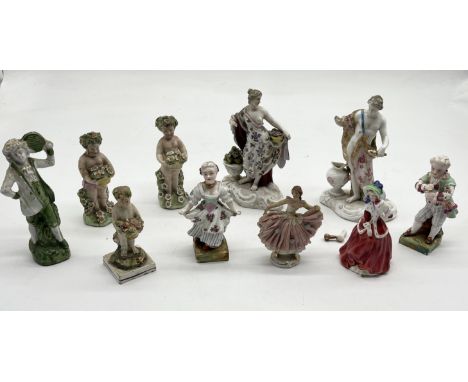 A collection of antique continental and other figurines including Meissen flute player and young lady, Staffordshire cherubs 