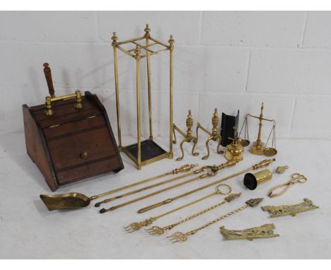 An antique mahogany coal scuttle, along with brass fireside companion sets, toasting forks, pair of fire dogs, scales etc.