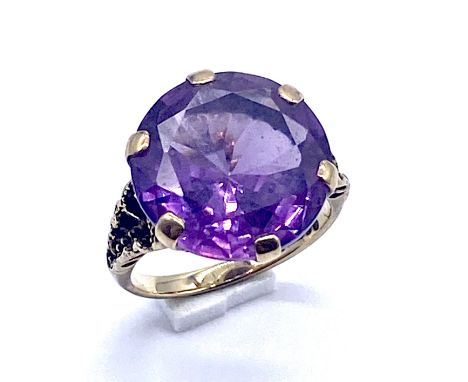 A 9ct gold solitaire amethyst dress ring, size P, 7.1g total weight.