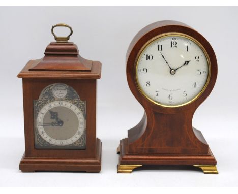 A vintage inlaid balloon mantle clock, with face named to 'Comitti of London', along with a Tempest Fugit clock