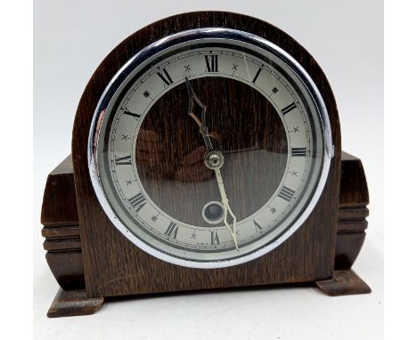 An Art Deco chrome and oak cased mantle clock, 17cm high.