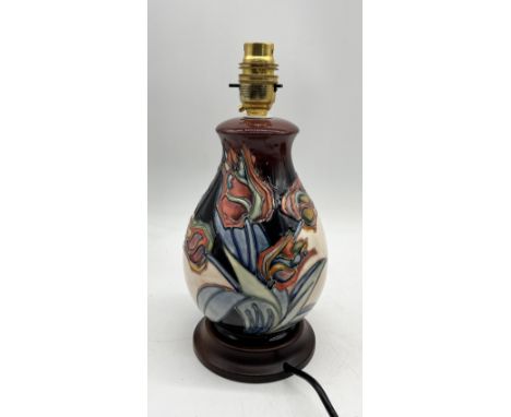 A Moorcroft table lamp with Red Tulip pattern designed by Sally Tuffin on turned base -height 26.5cm in total.