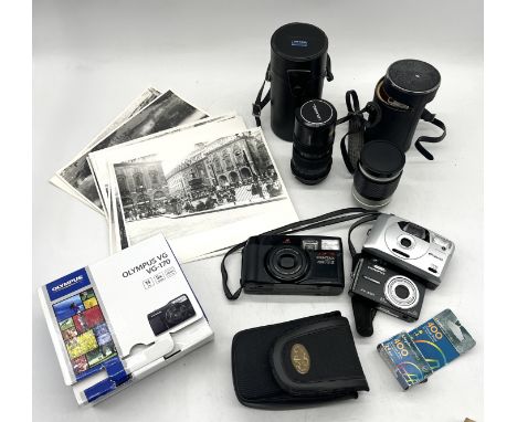 A collection of various cameras, lenses etc. including Pentax and Polaroid along with a number of black and white photographs