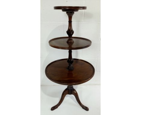 An antique mahogany three-tier dumb waiter on tripod base, A/F to base, 108cm high.