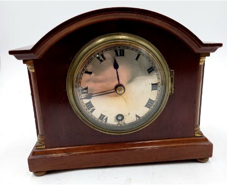 A W&S mahogany small pillared dome mantle clock with brass bun feet, 19cm wide 16.5cm high.