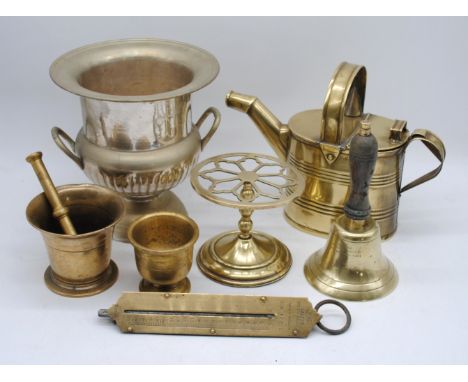 A quantity of various brassware, including a handbell, Salter scales, pestle and mortar etc.