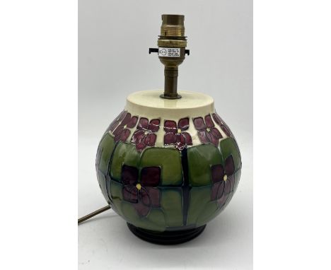 A Moorcroft 'Violets' pattern table lamp designed by Sally Tuffin - height 23cm