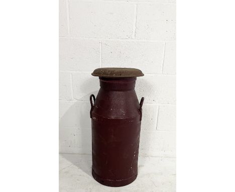 A vintage C.W.S. Co- operative Wholesale Society painted milk churn with weathered lid. Height 75cm