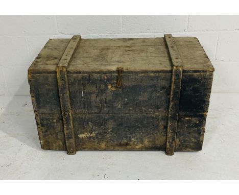 A rustic pine storage trunk