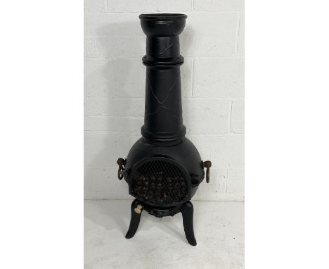 A cast iron chiminea on tripod base - 116cm high