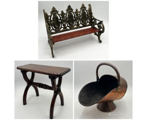 A miniature cast iron bench along with a copper coal scuttle and antique wooden stool