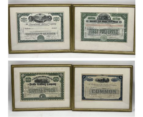 A collection of four framed share certificates for The Pacific Railway Company, The Baltimore Ohio Railway Company, The Penns