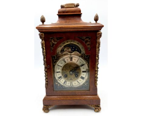 A vintage moon phase walnut cased bracket clock, with brass mounts and feet, 20cm wide, 36cm high. 
