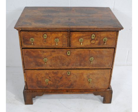A Queen Anne chest of four drawers, with brass handles, raised on bracket feet - length 81cm, depth 50cm, height 78cm