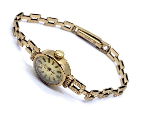 A 1980's Avia ladies 9ct gold wrist watch and strap, 17cm total length, 12.7g total weight. with original purchase reciept.