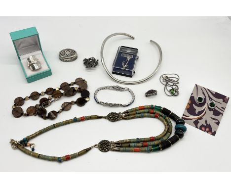 A collection of assorted vintage and fashion jewellery to include silver spoon ring, silver torque necklet etc.