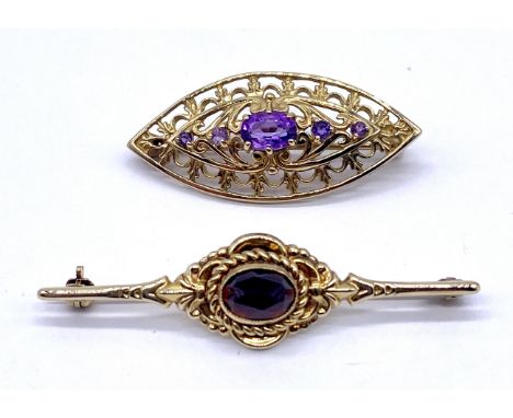 A 9ct gold filigree brooch set with amethyst along with a 9ct gold bar brooch set with faceted garnet, 5.7g total weight.