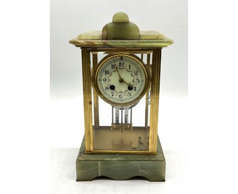 A 19th century French onyx and gilt clock with enamel dial and four glass panels 