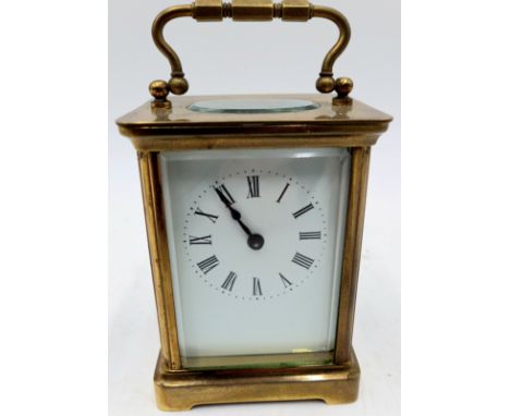 A brass carriage clock with cylinder escapement 10.5cm high.