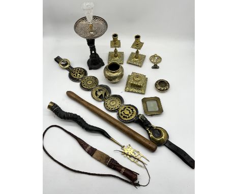 A collection of various items including an antelope horn toasting fork, brass candlesticks, Chinese brass bowl, horse brasses