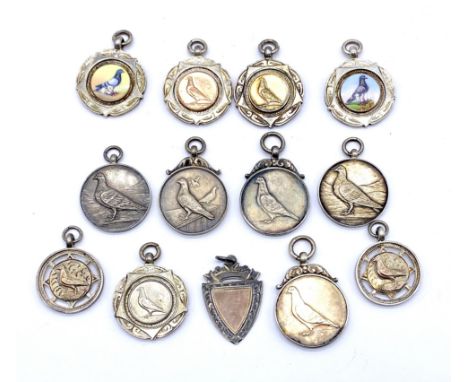 A collection of thirteen assorted 1920's and 1930's silver pigeon club medallions to include two enamelled, all presented to 