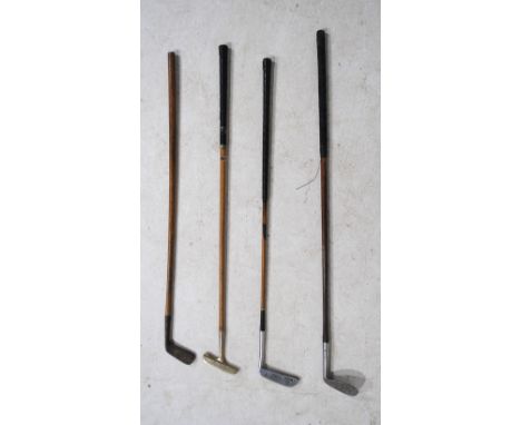 Four antique golf clubs, including some hickory shafted and named 'Army & Navy CSL', 'Golf Classics, St Andrews, Bowyer Bee-L