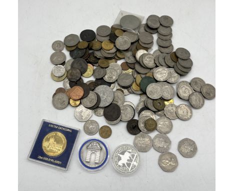 A collection of various coinage including Isle of Man 50 pence pieces, Hannover medallion etc.