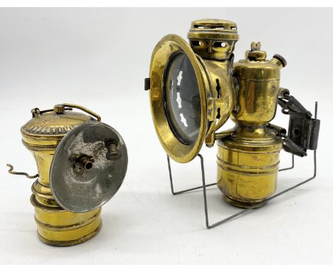 An antique brass bicycle lamp by Howell & Hanmer "Panther" along with a small brass "Daylight" carbide lamp