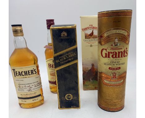 A boxed bottle of Johnnie Walker Black label whisky 70cl, bottle, a famous grouse 70cl and three other bottles