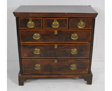 A Georgian campaign chest of six drawers, with brass handles, raised on bracket feet - length 96.5cm, depth 49.5cm, height 97