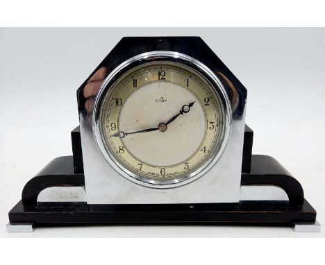 A 1930's Smiths 8-day chrome and ebonised wood cased mantle clock, 23cm wide, 14cm high.
