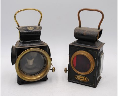 Two antique car lamps, marked 'Desmo' and 'Dumo'