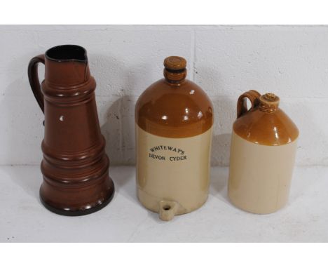 A large West German style ceramic jug, along with two stoneware jars, the larger marked 'Westway's Devon Cider', the other ma
