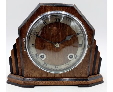 An Art Deco oak cased mantle clock Rotherham (R&S) 24cm wide 19cm high.