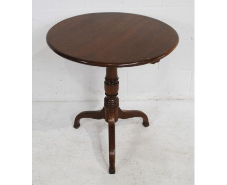 An antique mahogany circular tripod table, with turned detailing - diameter 66cm, height 70.5cm
