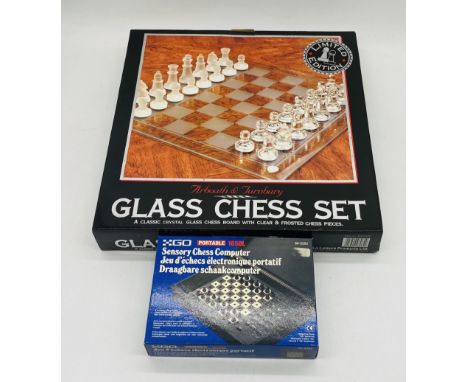 A boxed limited edition Arboath & Turnbury glass chess set, along with a boxed portable sensory chess compute set