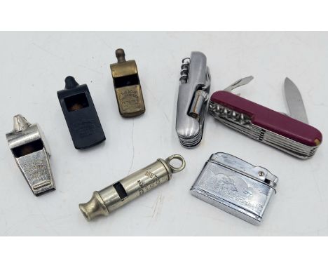 A vintage Metropolitan police whistle, set of three Acme Thunder whistles, chrome, brass & Bakelite, two Swiss army knives an