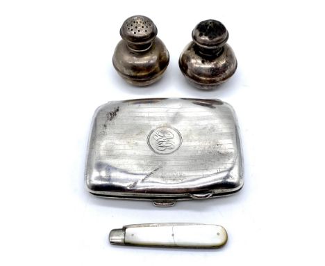 A pair of silver pepperettes along with a silver cigarette case ( A/F) and a silver bladed fruit knife (weight excluding frui