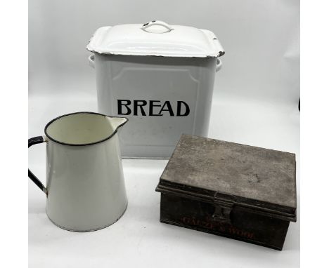 A large enamel bread bin along with a W&Y "Gauze & Wool" wartime tin by Hepburn & Cook and an enamel jug