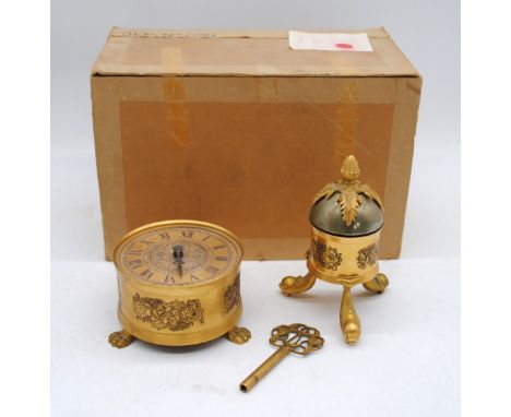 An antique boxed Sinclair Harding brass clock, with detachable alarm and key