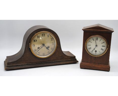 An antique oak mantle clock, with key, along with a vintage oak mantle clock