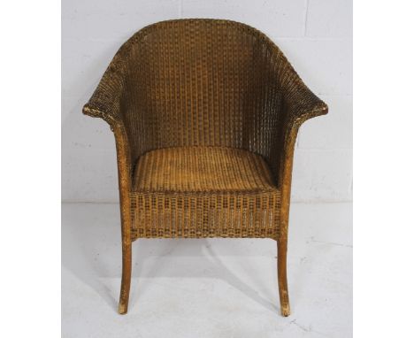 A vintage gold-painted Lloyd Loom style chair