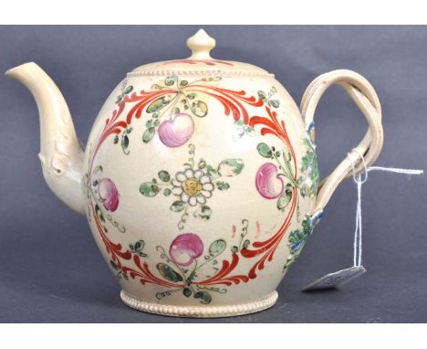 An 18th Century Georgian English antique creamware ceramic teapot possibly early Wedgwood with hand painted floral and scroll